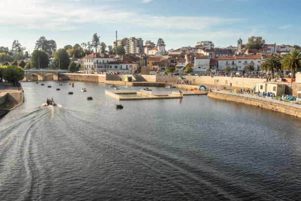 City of Águeda in Portugal, view over the river Águeda with the houses in the background, on a summer afternoon. stock photo