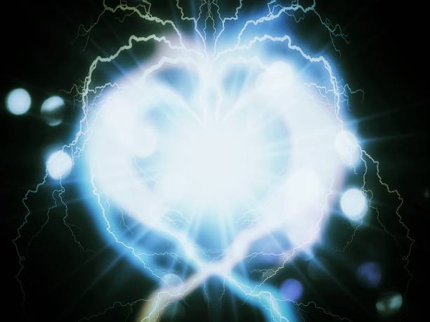 istock 3d illustration of heart shaped light shining in the dark 1436247617