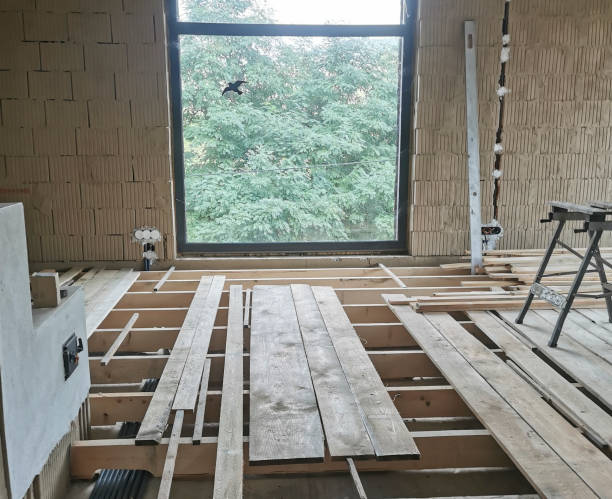 istock floorer laying a floor in a building 1436249366