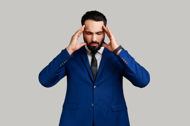 istock Man suffering intense headache, having unbearable migraine, fever and flu symptoms. 1436258584