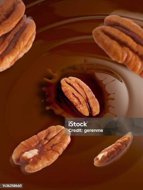 Pecans Falling Into Chocolate Fudge Stock Photo - Download Image Now - Chocolate, Pecan, Liquid
