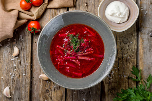 istock Borscht with sour cream on old wooden table top view 1436266196