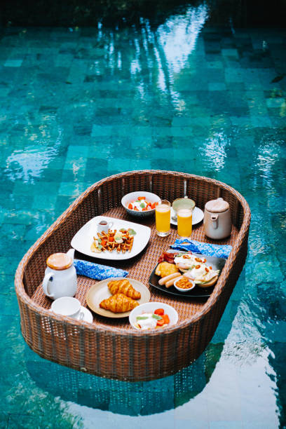 istock Breakfast tray is floating on the swimming pool 1436272579