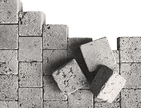 conceptual broken brick wall, isolated