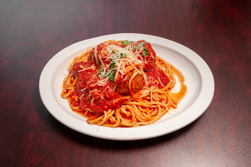 Heaping bowl full of delicious spaghetti and meatballs