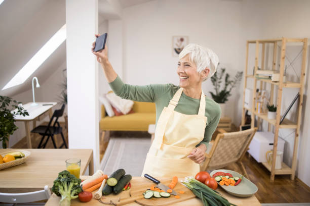 istock Woman taking selfie in kitchen 1436277281