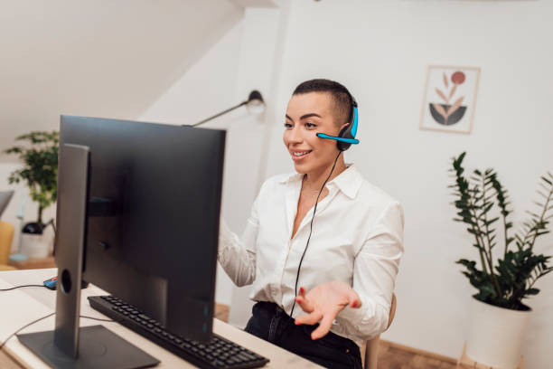 istock Woman talking on heandphones 1436277334