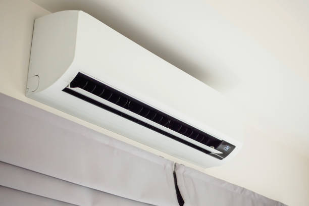 istock Air conditioner on white wall room interior background 1436277502
