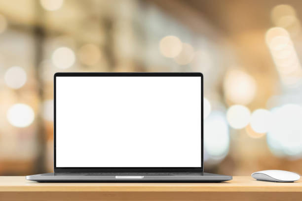 istock Laptop with blank screen on wood table with cafe coffee shop blur background 1436277617