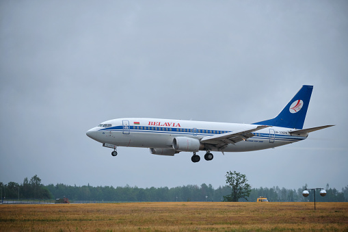Minsk, Belarus - June 15, 2018: Belavia belarusian airlines flight Boeing 737-300 plane landing on runway in National Airport Minsk