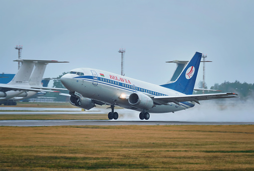 Minsk, Belarus - June 15, 2018: Belavia belarusian airlines flight Boeing 737-500 plane taking off on runway in National Airport Minsk