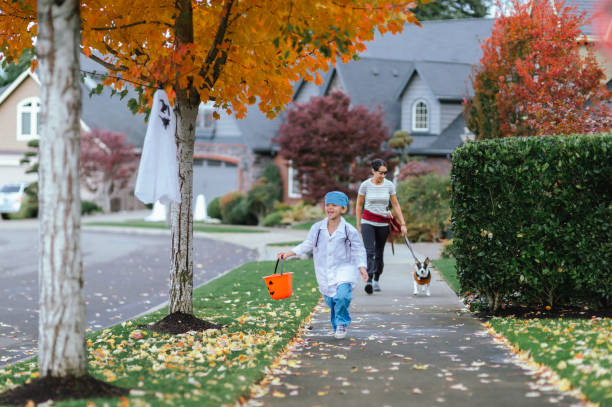 istock Young Family Trick Or Treating Together 1436280148