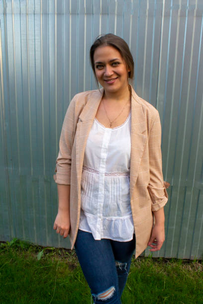 istock young beautiful woman in a jacket and jeans 1436282655
