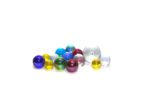 colored glass beads on white background