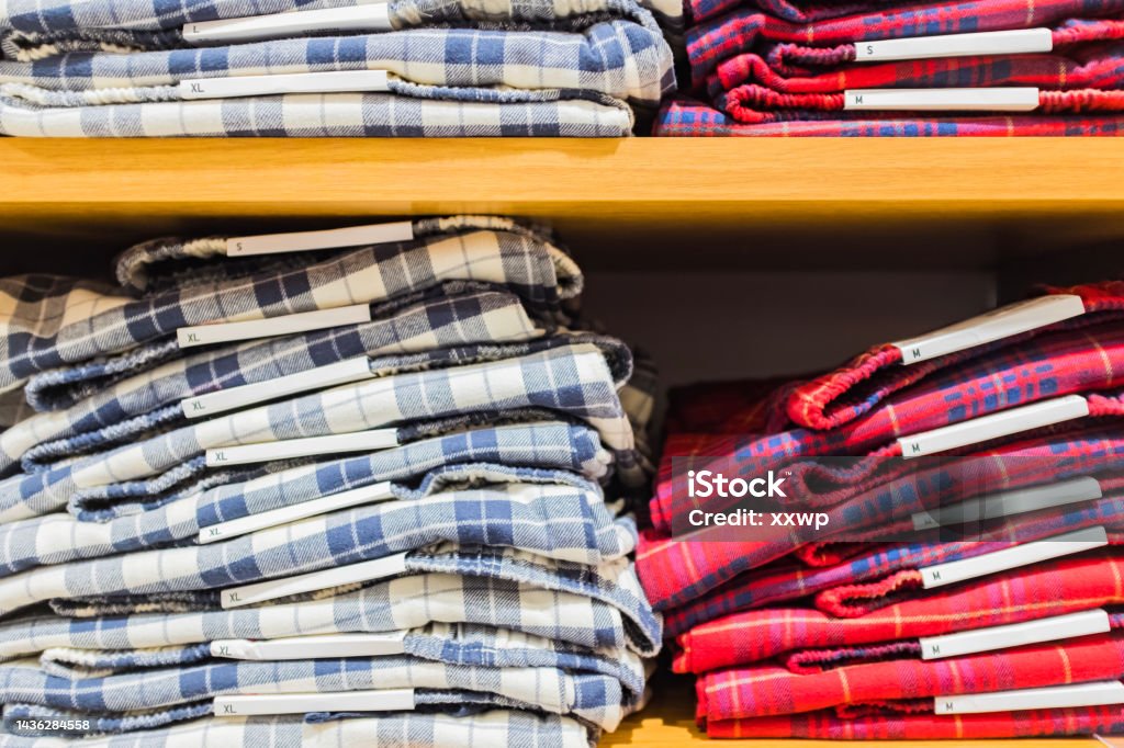 Many plaid shirts on the shelf Shirt Stock Photo