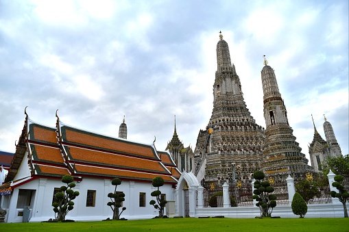 Wat Arun, The Temple of Dawn, by the Chao Phraya River in Bangkok Thailand.