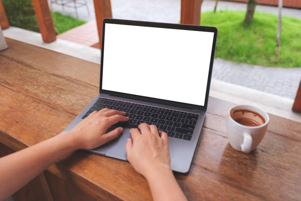 istock Mockup image of a woman using and typing on laptop computer with blank white desktop screen 1436302273