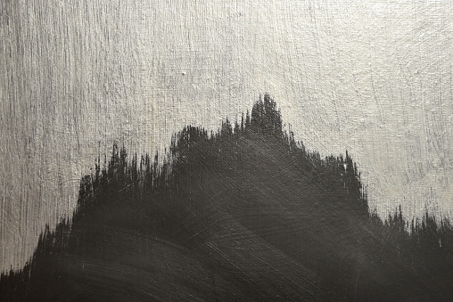 abstract black and white background in the form of mountains with brush strokes