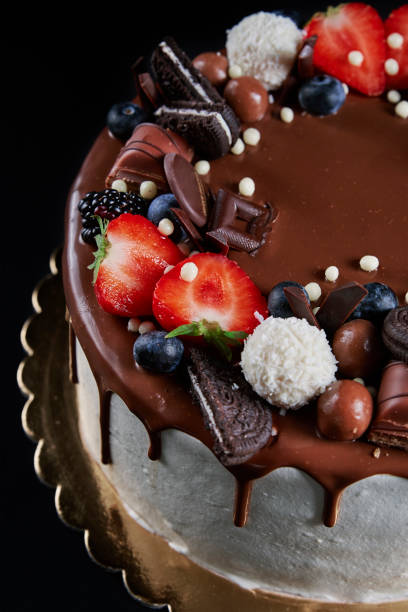 istock Cake decorated with strawberry and chocolate on dark background 1436307092