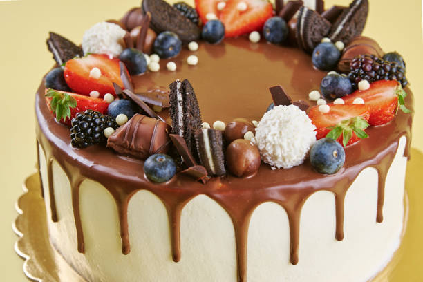 istock Cake decorated with strawberry and chocolate on yellow background 1436307094