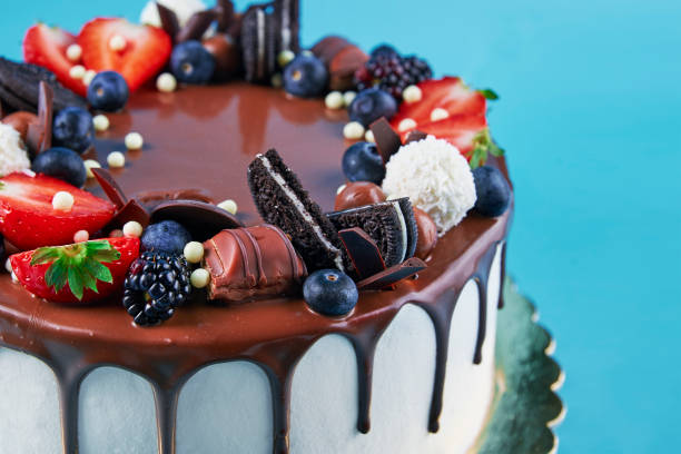 istock Cake decorated with strawberry and chocolate on blue background 1436307095