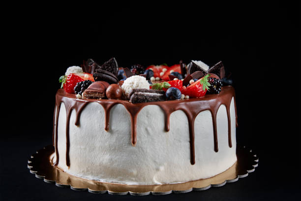 istock Cake decorated with strawberry and chocolate on dark background 1436307096