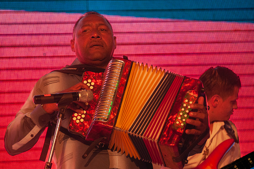 Bogota Colombia 15de Mayo 2016
Black man playing an accordion with the colors of the Colombian flag
