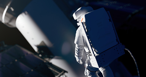 Astronaut in a white space suit works with a spaceship in an outer space in a beautiful light for a cosmic designs