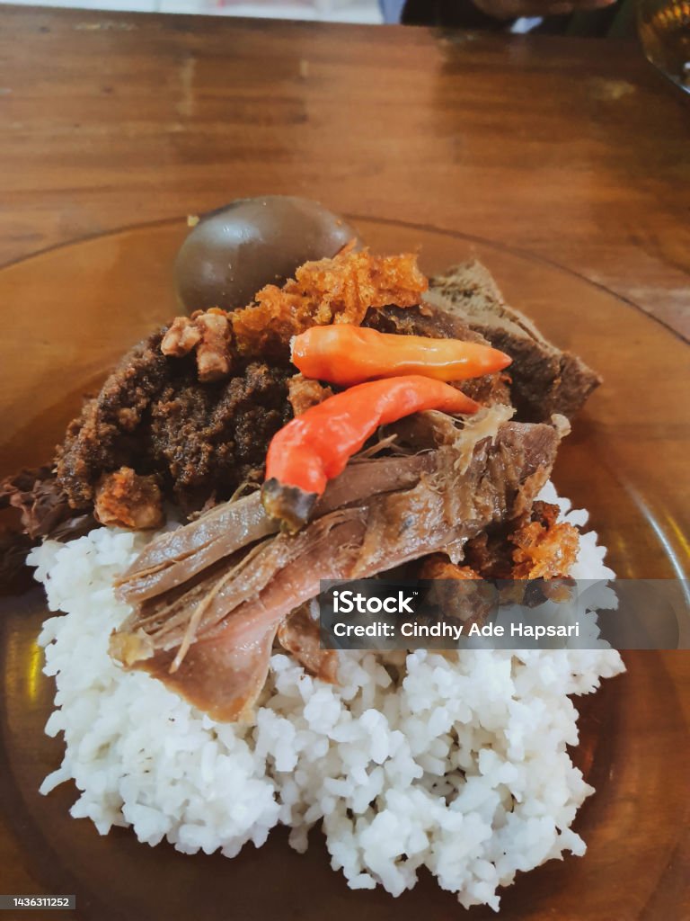 Gudeg Bu Slamet, which is located on Jalan Wijilan, Jogjakarta, is suitable for people who like gudeg with a taste that is not too sweet. Gudeg Bu Slamet, which is located on Jalan Wijilan, Jogjakarta, is suitable for people who like gudeg with a taste that is not too sweet. Served with bacon, krecek and chicken eggs. Gudeg is a typical food from Yogyakarta. Cattle Stock Photo