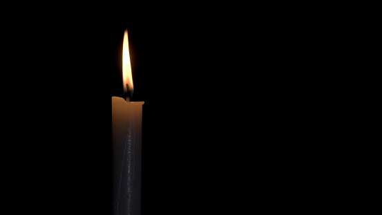 A Candle Burns with a Bright Flame on a Black Background. The Flame of a Wax Candle Glows Mysteriously in the Darkness. Illustration of Remembrance, Celebration or Religious Ceremony