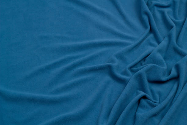 istock Fleece fabric blue top view. Texture of textile fleece bedspread. 1436314277