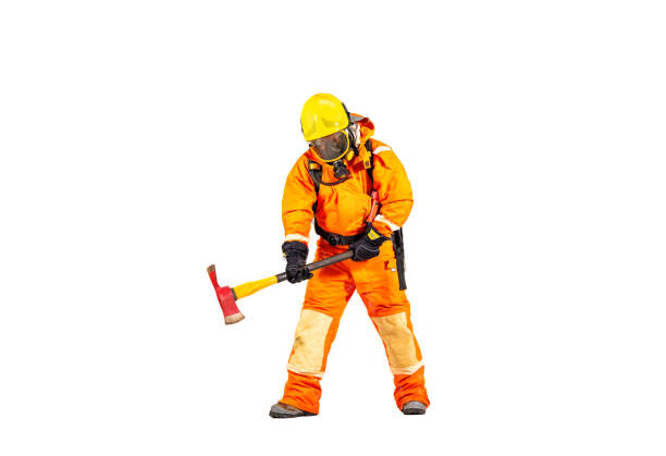 Firefighter man wearing protective fire suite and helmet with equipment and accessories is fire safety accident protection with white background.