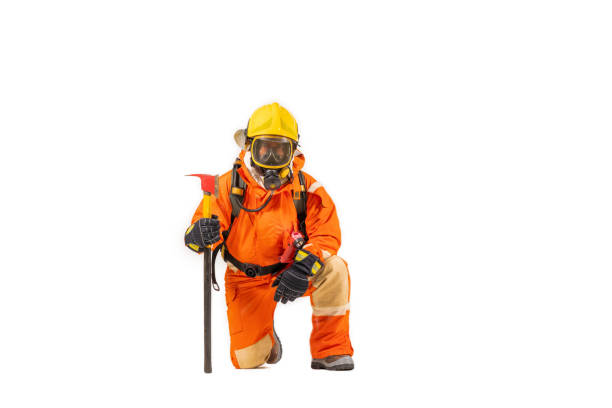 istock Firefighter man wearing protective fire suite and helmet with equipment and accessories is fire safety accident protection with white background. 1436317436