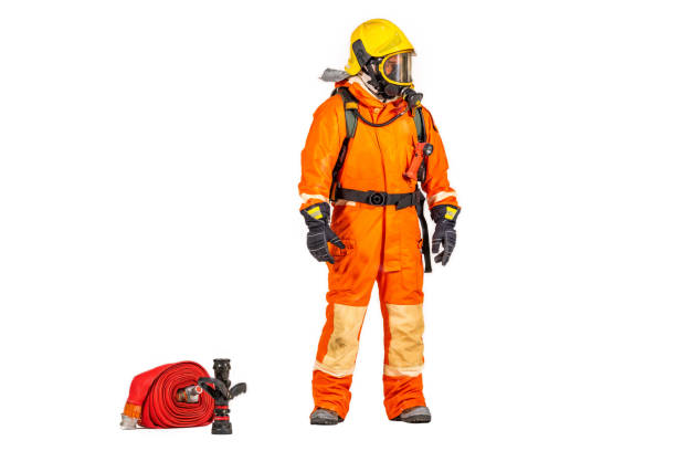 istock Firefighter man wearing protective fire suite and helmet with equipment and accessories is fire safety accident protection with white background. 1436317474