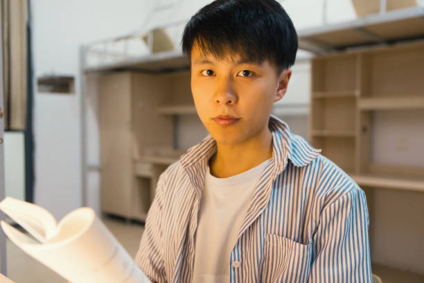 istock A college student in a college dormitory studies hard 1436317931