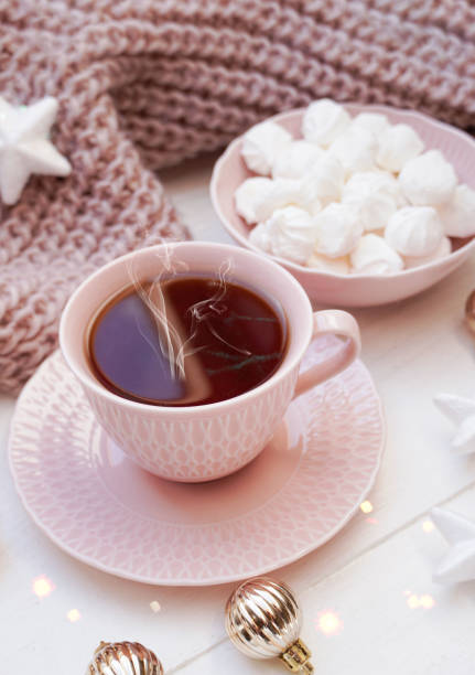istock Winter, Christmas, New Year decorations composition, concept, background. Mug, cup of tea, coffee and meringue. Christmas lights. Christmas mood. Morning, breakfast. Christmas greeting card. 1436320097