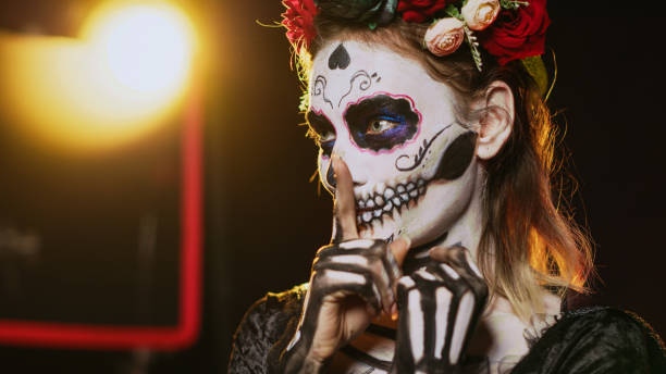 istock Holy santa muerte expressing mute secrecy sign 1436322348