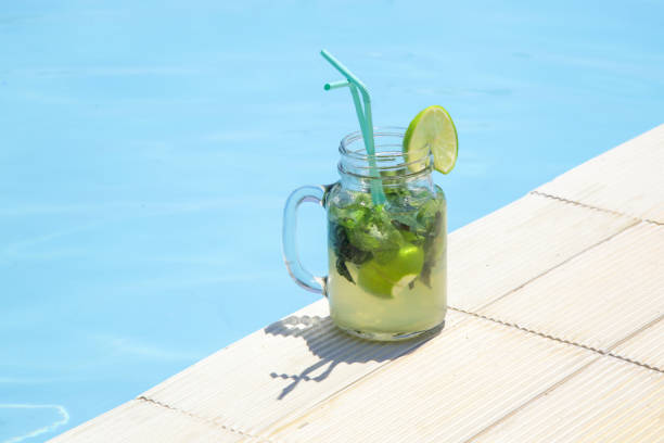 istock Mojito cocktail in glass jar next to the pool 1436325618