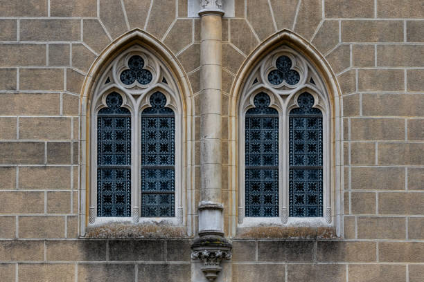 istock Gothic medieval stained glass window and stone arch.  Architectural element. 1436326208