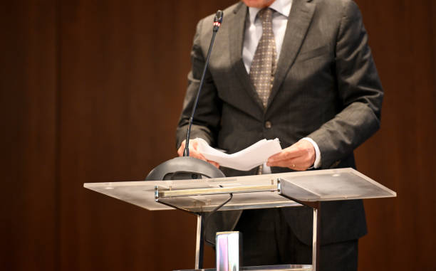 istock Businessman at the lectern 1436327312