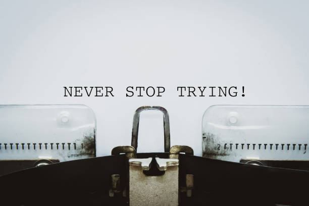 istock Never stop trying text typed on a vintage typewriter. 1436327512