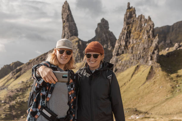 istock Two female hikers resting and taking a selfie in Scotland 1436327628