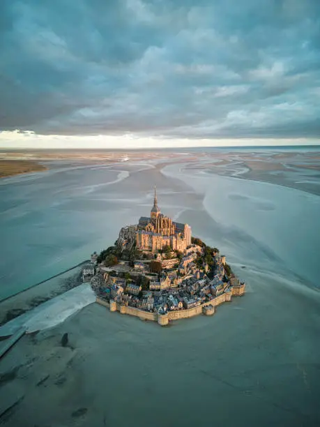 Photo of Top view at sunrise of the bay of Mont Saint Michel, Normandy, France.