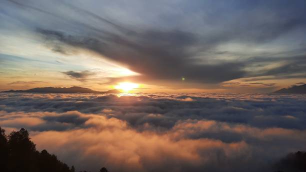 istock sunrise/sunset  in the mountains above the clouds 1436329274