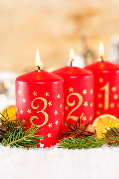 istock Third 3rd Sunday in advent with candle Christmas time decoration portrait format 1436329729