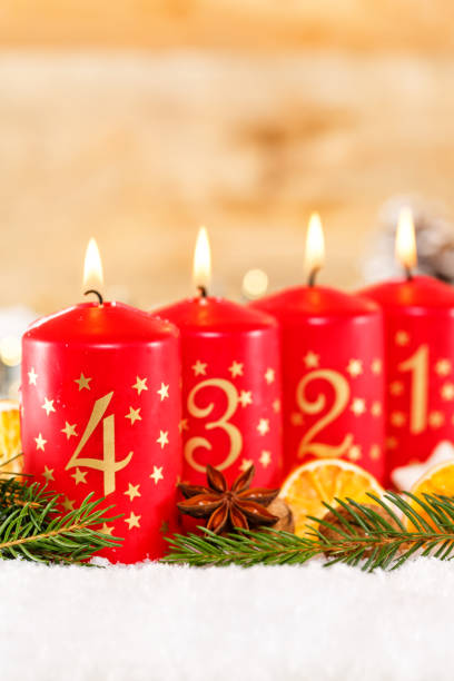 istock Fourth 4th Sunday in advent with candle Christmas time decoration portrait format 1436330754