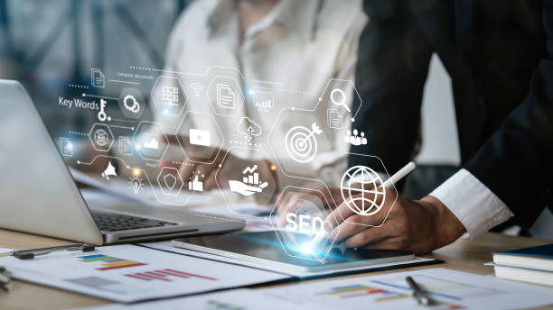 istock Two business IT professionals manage search engine optimization: SEO with social media content and website ads, processing, banners with copy space. 1436331101