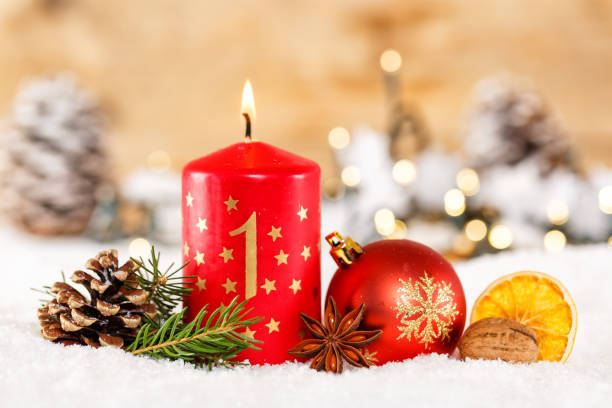 istock First 1st Sunday in advent with candle Christmas time decoration 1436331407