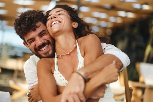 istock Cheerful embraced couple having fun in summer day. 1436332503