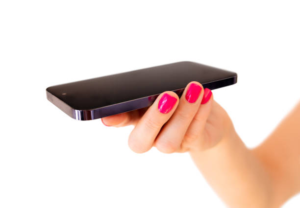 Person holding mobile phone in palm with screen flat upside, isolated on white background